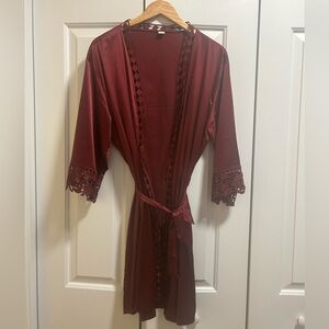 Maroon silk robe. Details on sleeves and trim.